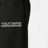 Zoom sur la broderie latérale Tourismo™ du pantalon