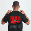 Gros plan du T-shirt noir Toyota Supra MK4 avec inscription 2JZ oversize et Supra orange