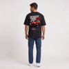 T-shirt Peugeot 205 GTI noir porté de dos en plan large